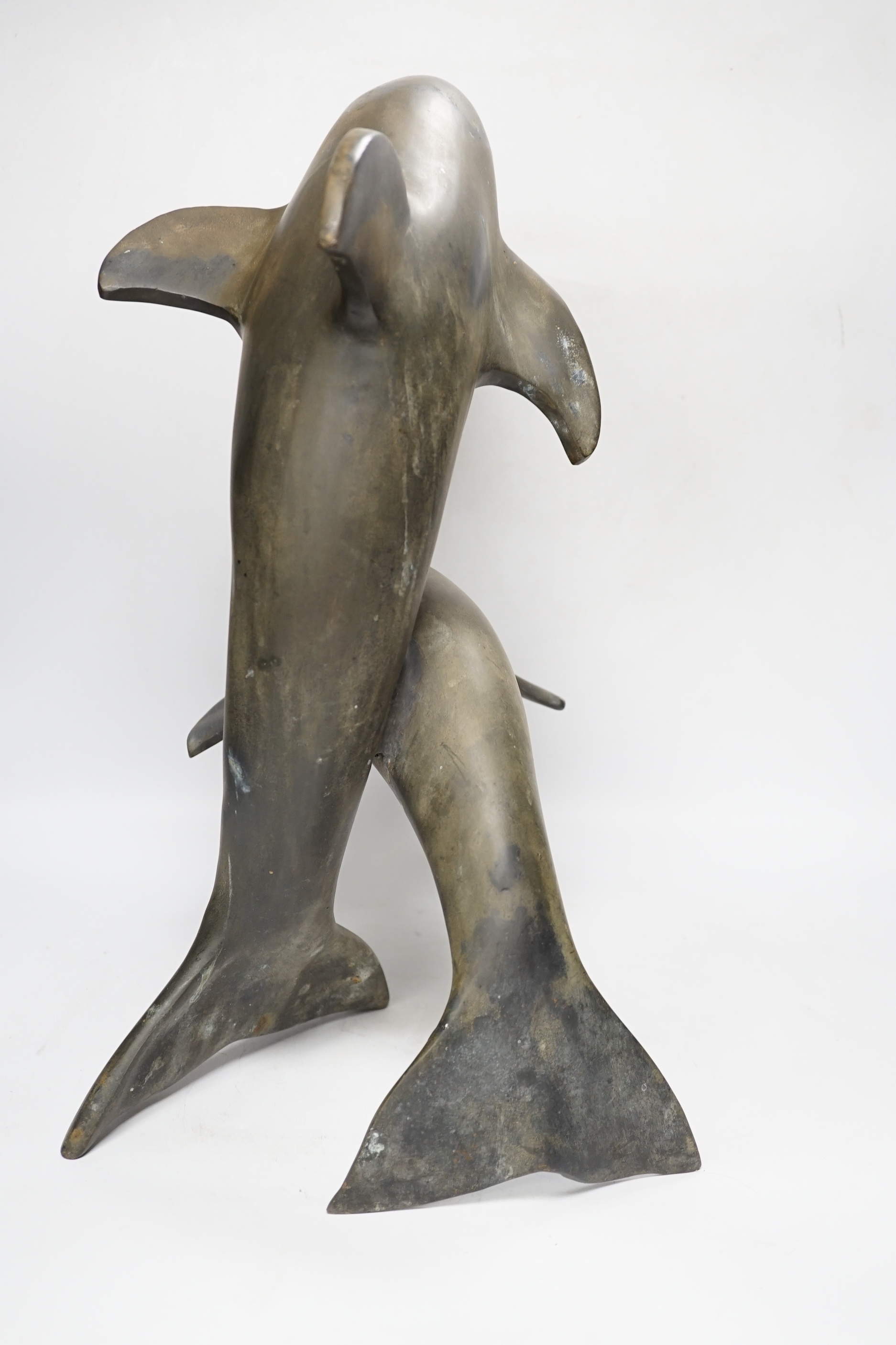 A hollow cast bronze dolphin group, 48cm